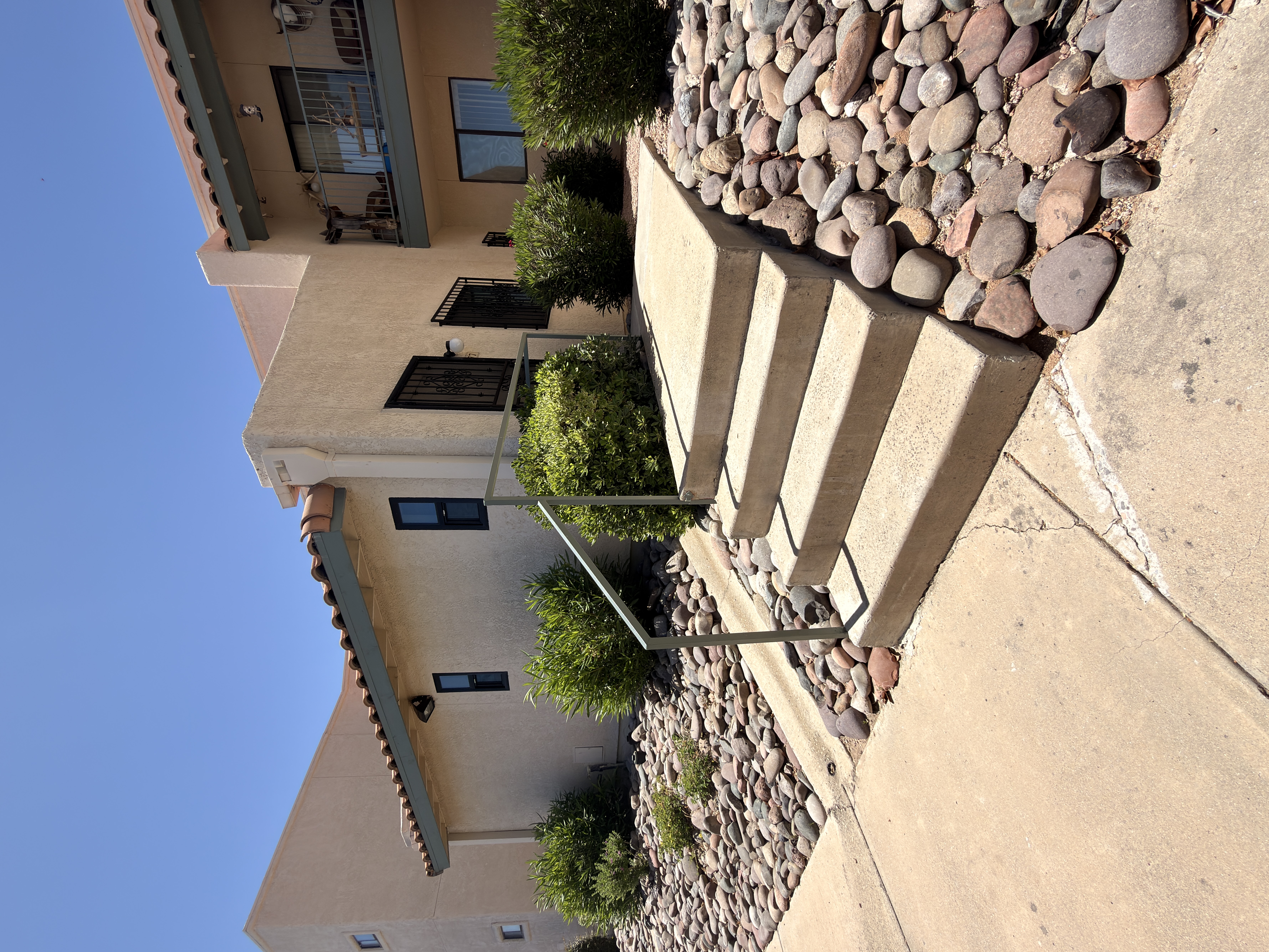 Front entry · river-rock landscaping