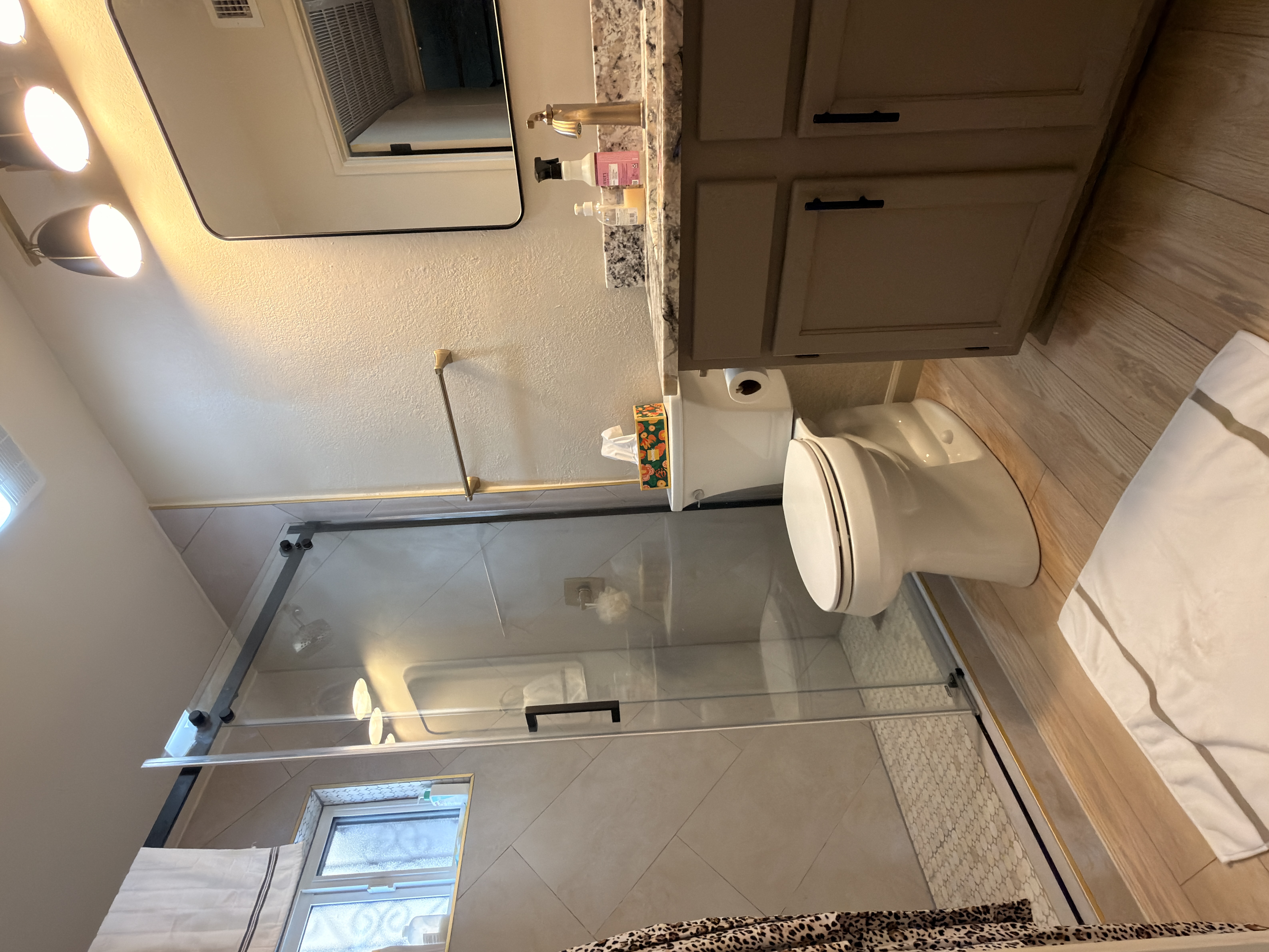 Bath approach · iron-grille window