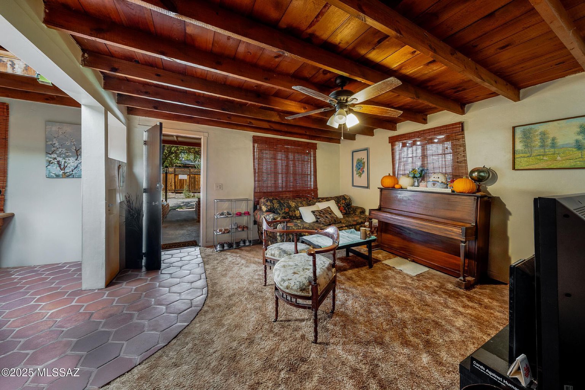 Living room · exposed wood beam ceiling